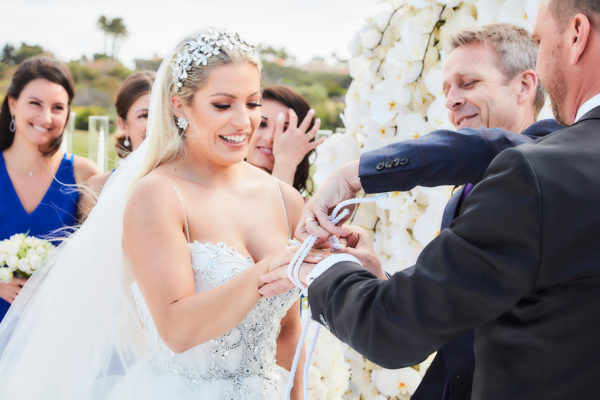 video of bride and groom exchanging rings at monarch beach resort